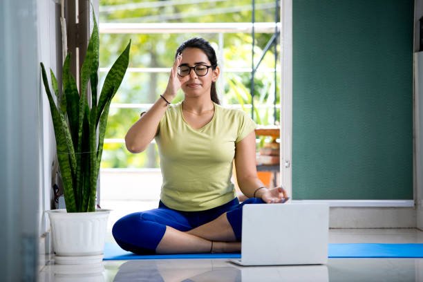 Young woman in yoga at home